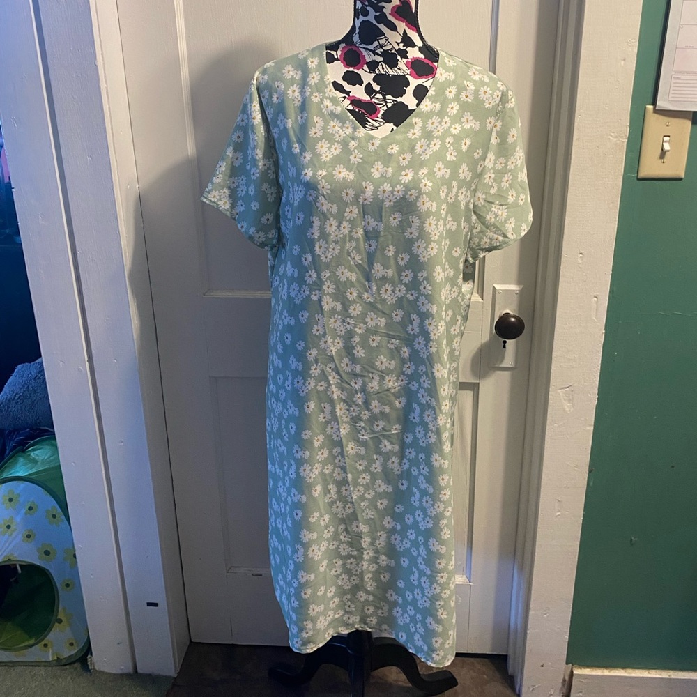 Calf-length green dress with white flowers